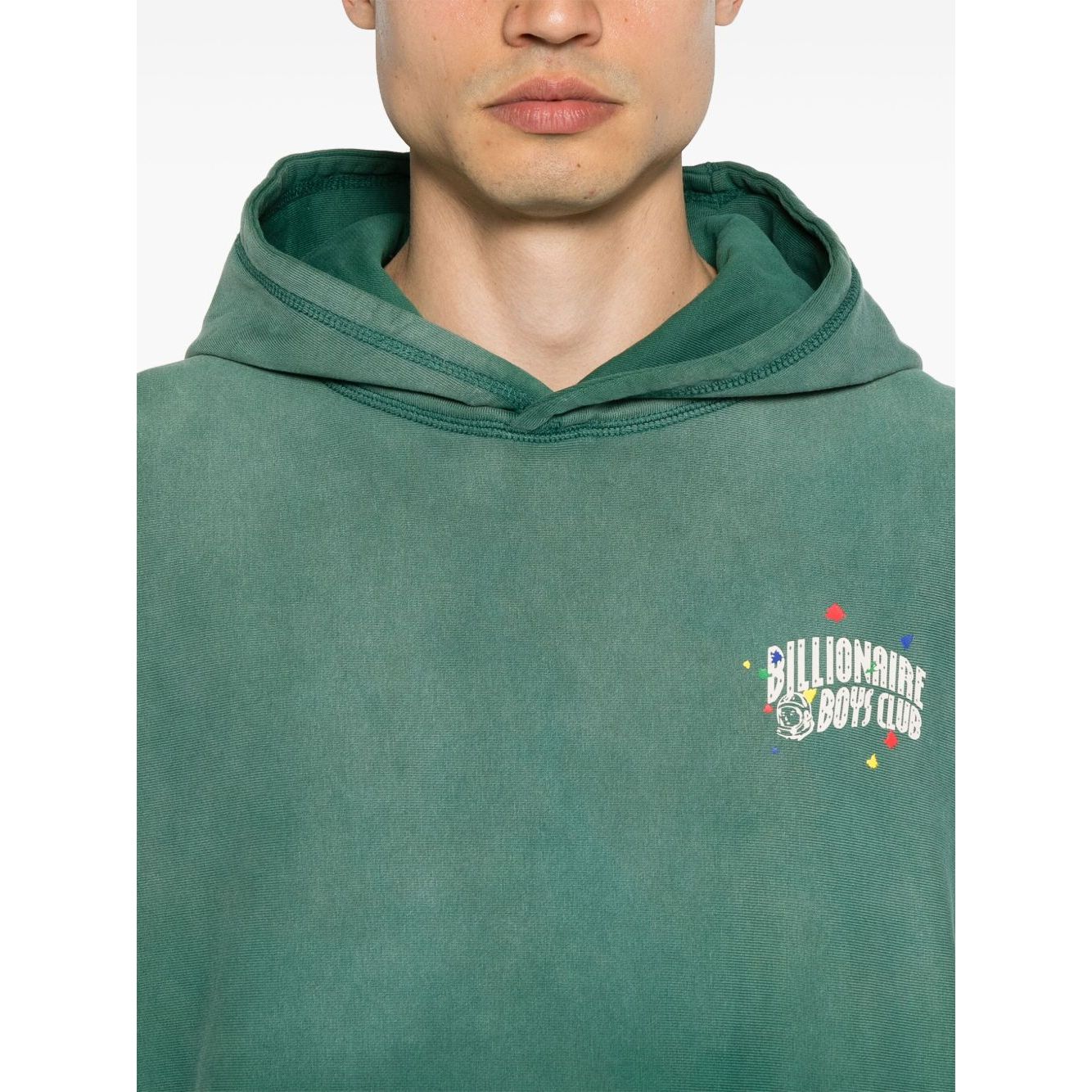 Billionaire Sweaters Green oversized hoodie with front logo and ribbed cuffs. Grass green color, worn by model standing.