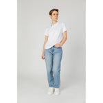 Woman wearing Blauer White Polyester T-Shirt with jeans, showcasing short sleeves and comfortable fit.