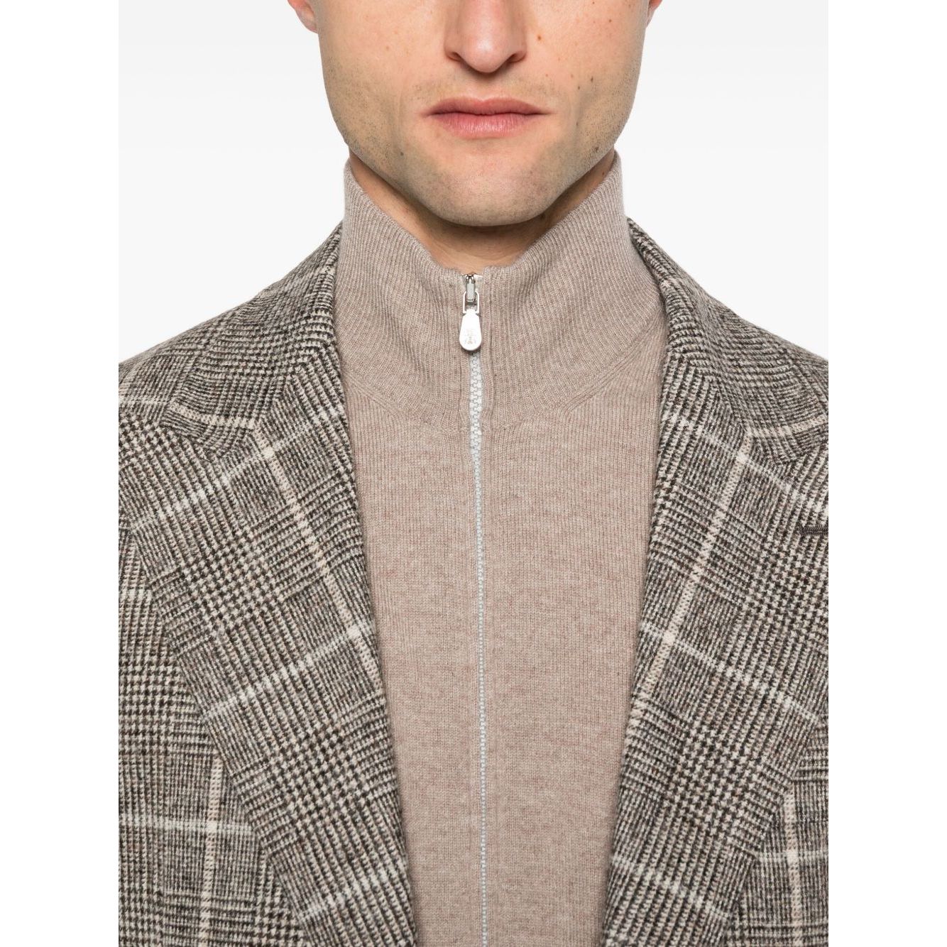 Man wearing Brunello Cucinelli Cashmere Zipped Cardigan with a brown high neck and zip fastening, styled under a plaid jacket.