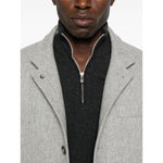 Brunello Cucinelli Cashmere sweater with grey half-zip, long sleeves, ribbed cuffs, and curved hem, showcased by model.