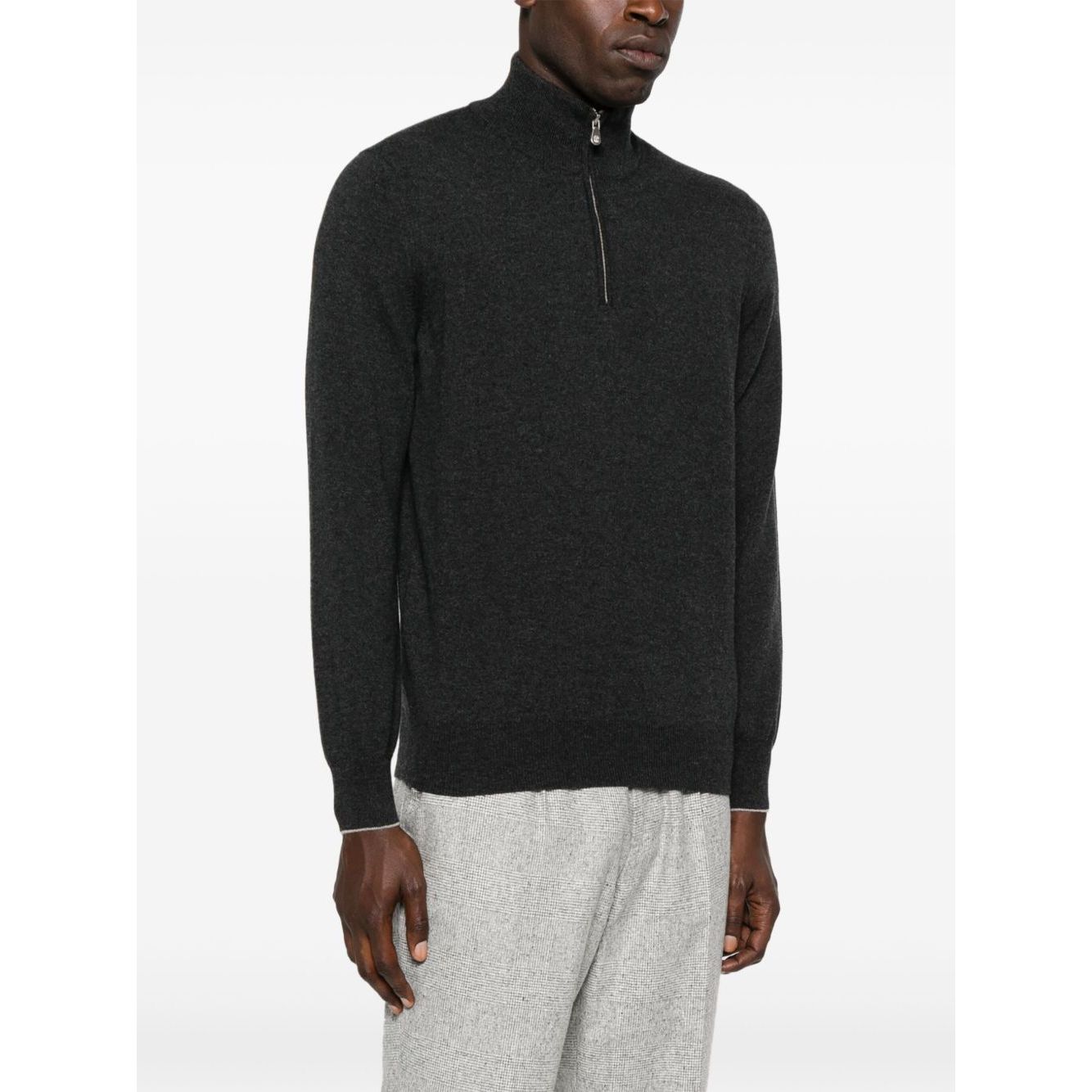 Man wearing Brunello Cucinelli Cashmere sweater in grey with half front zip fastening, long sleeves, ribbed cuffs, and curved hem.
