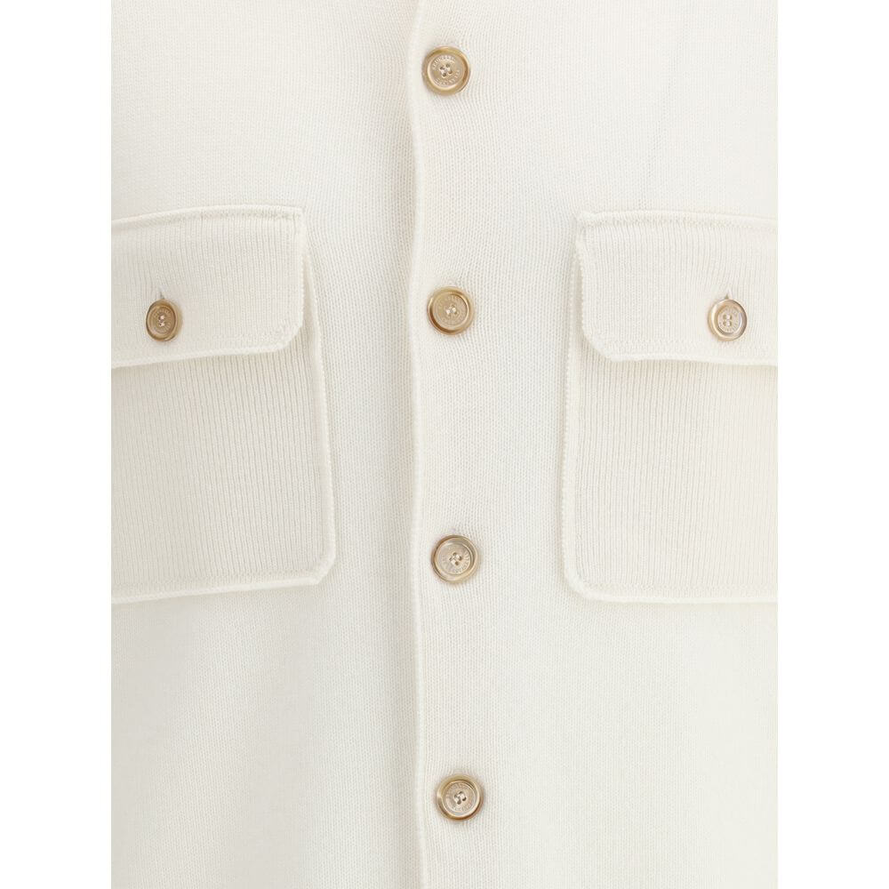 Close-up of Brunello Cucinelli White Cashmere Cardigan with buttons and pockets, featuring ribbed texture and classic design.
