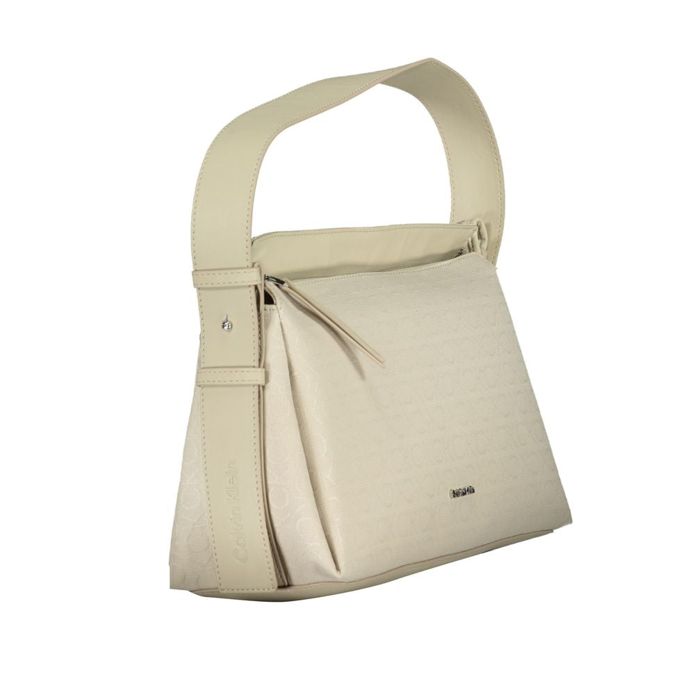 Calvin Klein Beige Polyester Handbag with dual handles, adjustable shoulder strap, and external pocket.