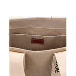 Interior view of Chloé Chloe Woody Medium Tote Bag showing the linen composition and internal flat pocket.