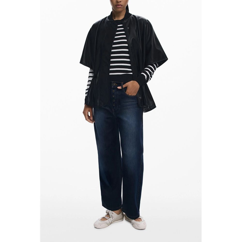 Woman wearing Desigual Black Polyethylene Women Poncho with striped shirt and jeans, showcasing eclectic style and elegance.
