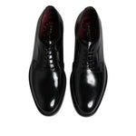 Dolce & Gabbana Black Calf Leather Lace Up Dress Shoes with logo detail, made in Italy, featuring leather sole and lace up closure