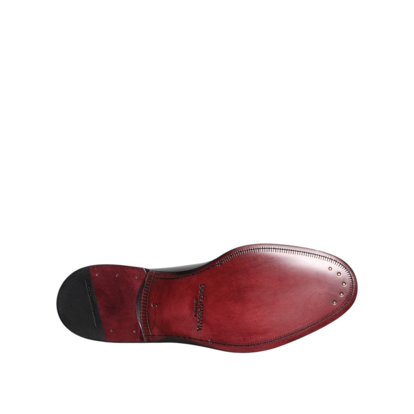 Sole view of Dolce & Gabbana Black Calf Leather Lace Up Dress Shoes, featuring fine Italian craftsmanship and logo details on leather sole.