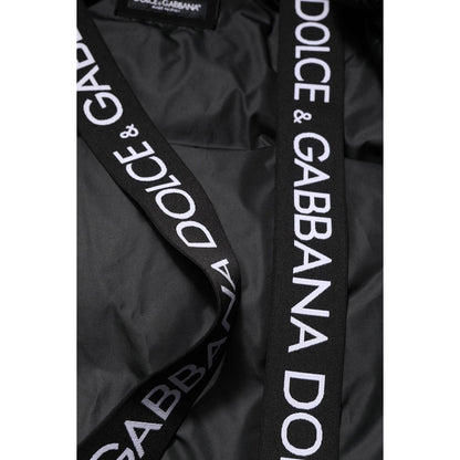 Close-up of Dolce & Gabbana Black Logo Full Zip Hooded Quilted Jacket with logo details on straps.
