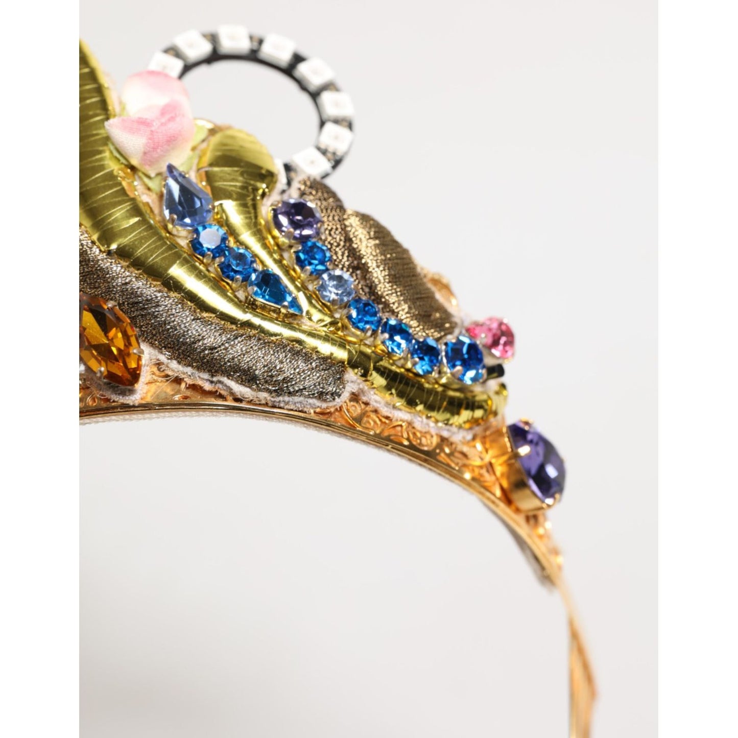 Close-up of Dolce & Gabbana Gold Brass Crystal Embellished Headpiece Crown Tiara with colorful crystals and floral details.