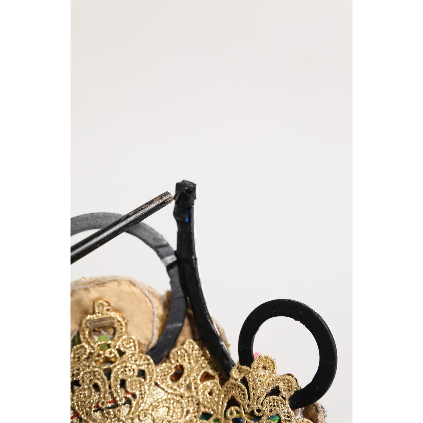 Dolce & Gabbana Gold Brass Crystal Embellished Headpiece Crown Tiara detail showing floral and crystal appliqués.