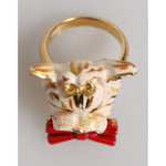 Dolce & Gabbana Gold Brass Resin Beige Dog Pet Accessory Ring with red bow detail.