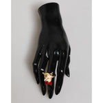 Dolce & Gabbana Gold Brass Resin Beige Dog Pet Accessory Ring on display with black mannequin hand.