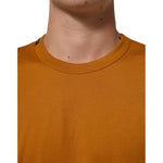 Dolce & Gabbana Golden Brown Crew Neck Short Sleeve T-shirt in premium cotton, showcasing Italian craftsmanship and classic design.
