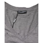 Dolce & Gabbana Gray Cotton Tattered Logo Patch Men T-shirt with deep V-neckline and distressed fabric detailing.