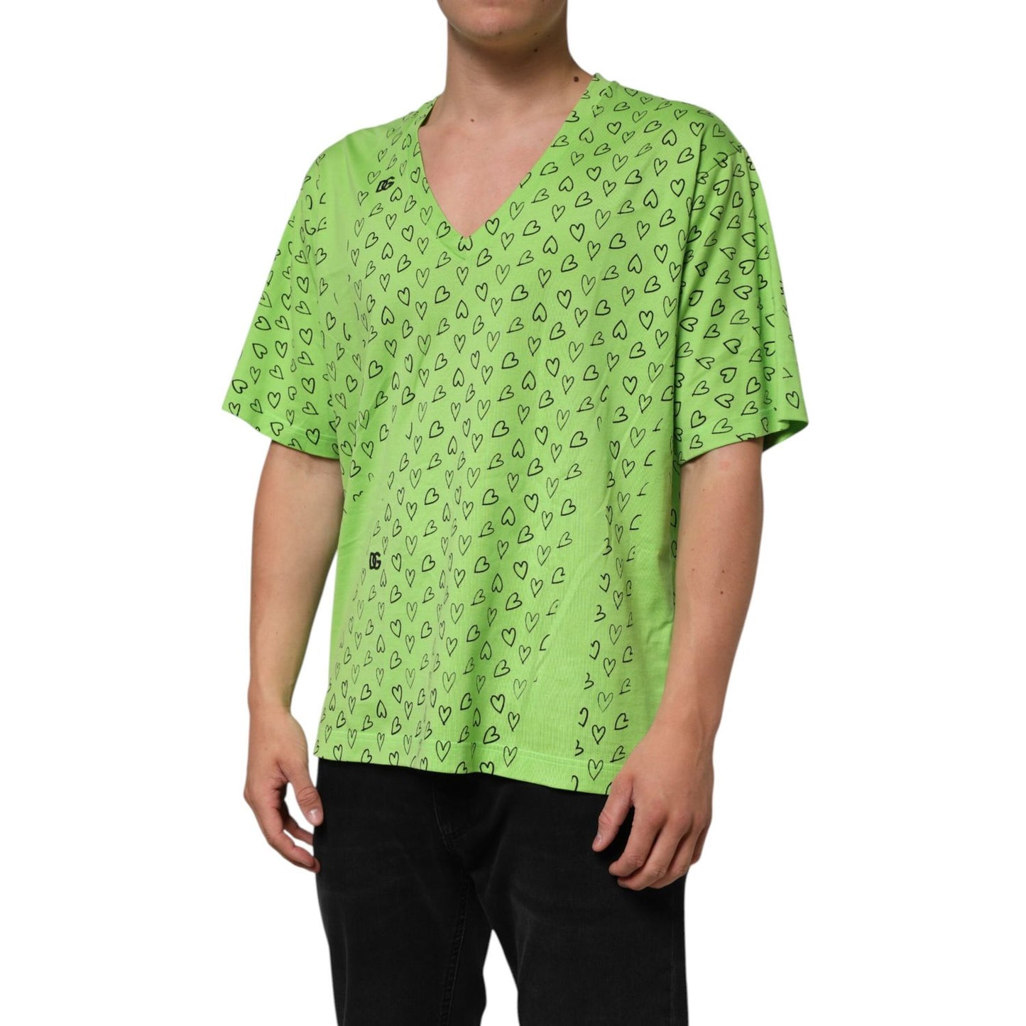 Dolce & Gabbana Green V-Neck DG Logo Heart Print T-shirt with black heart design, oversized fit, and short sleeves modeled on a person.