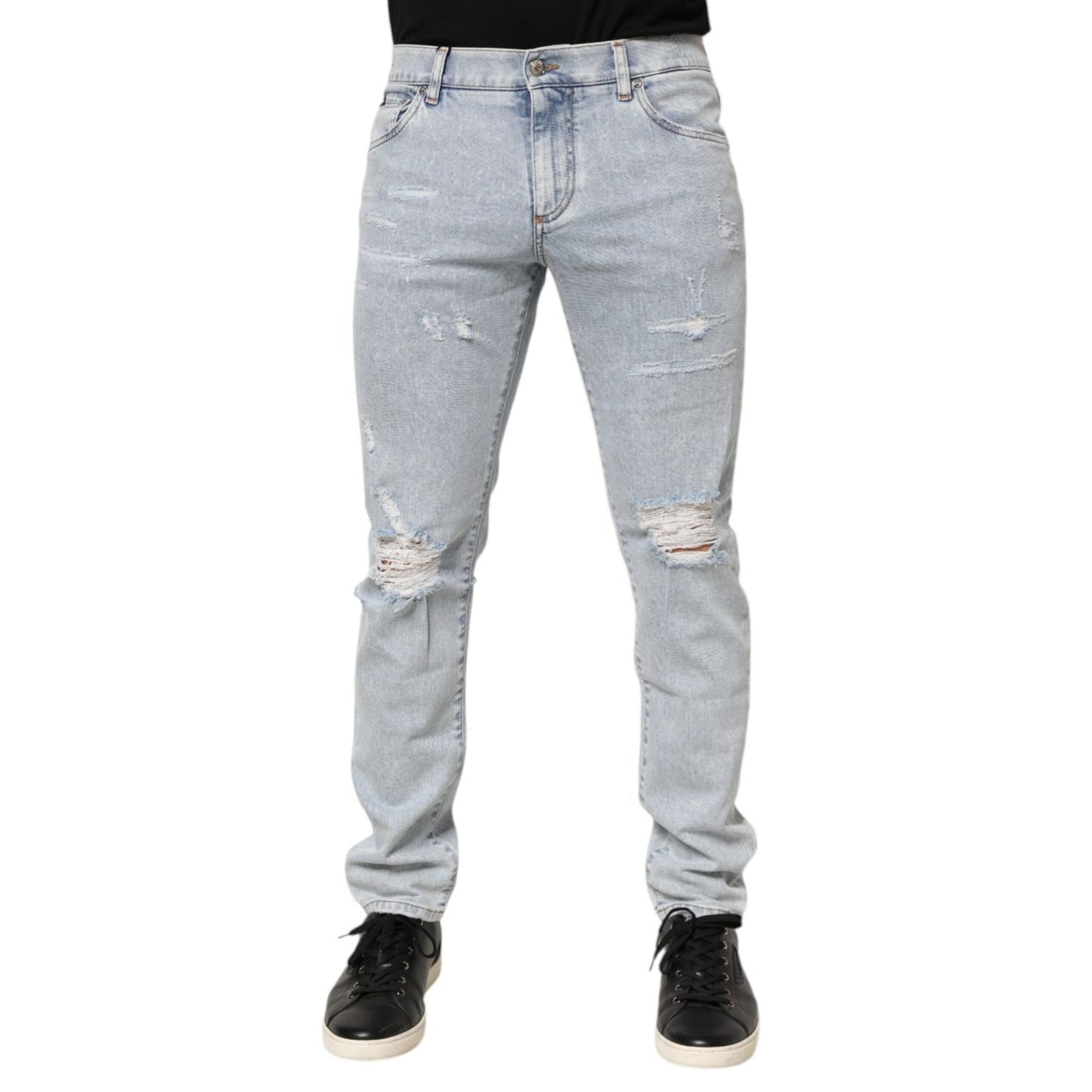 Dolce & Gabbana Light Blue Distressed Slim Fit Ripped Denim Jeans on model showcasing the trendy edgy design.