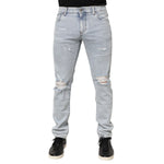 Dolce & Gabbana Light Blue Distressed Slim Fit Ripped Denim Jeans showcasing trendy ripped design and slim straight leg cut.