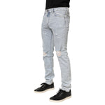 Dolce & Gabbana Light Blue Distressed Slim Fit Ripped Denim Jeans for men, featuring a trendy design and premium Italian denim.