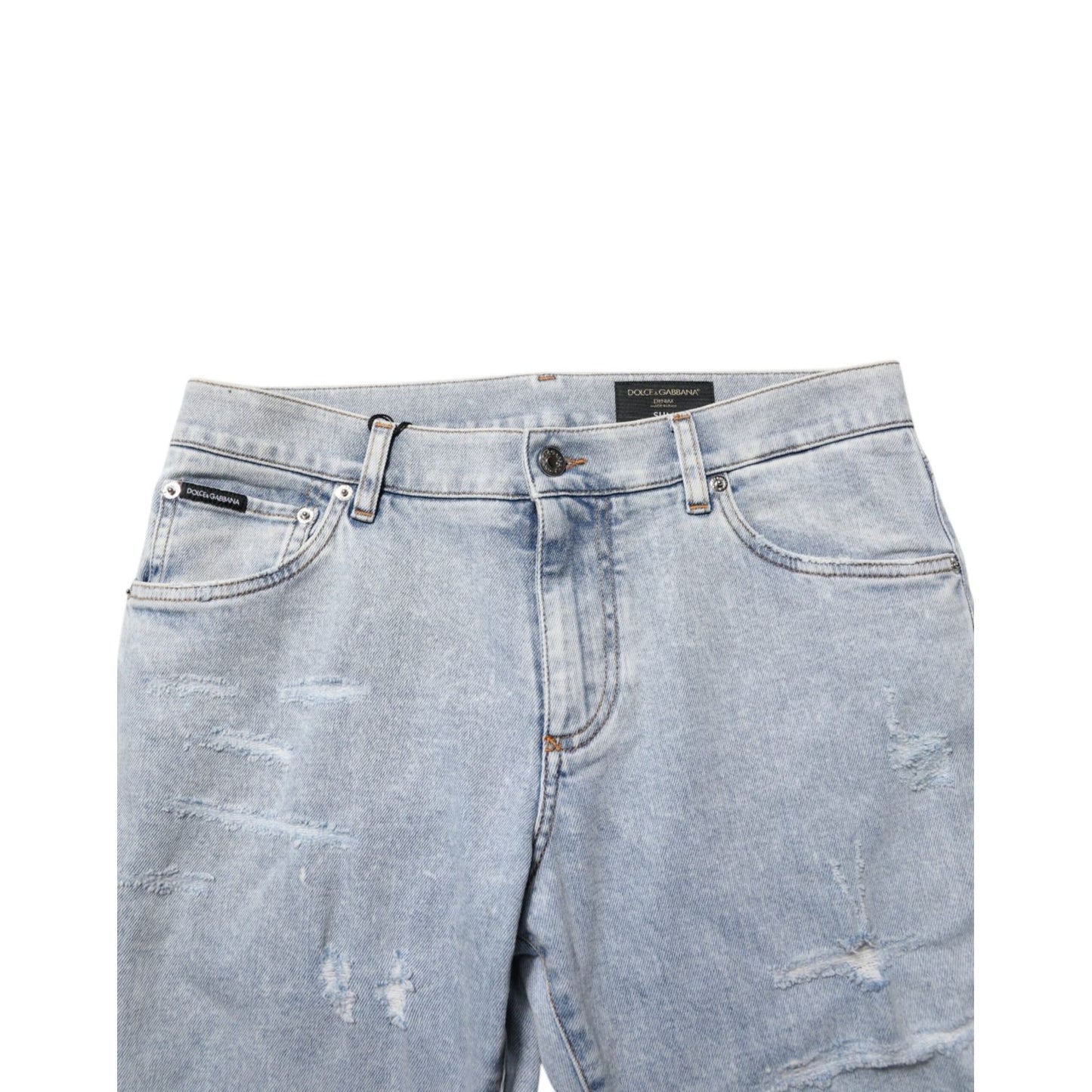 Close-up of Dolce & Gabbana Light Blue Distressed Slim Fit Ripped Denim Jeans with five-pocket design and distressed details.