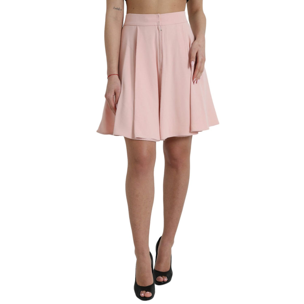 Dolce & Gabbana Light Powder Rose Viscose Pleated Skirt with high waist and flared silhouette, shown on model in black heels.