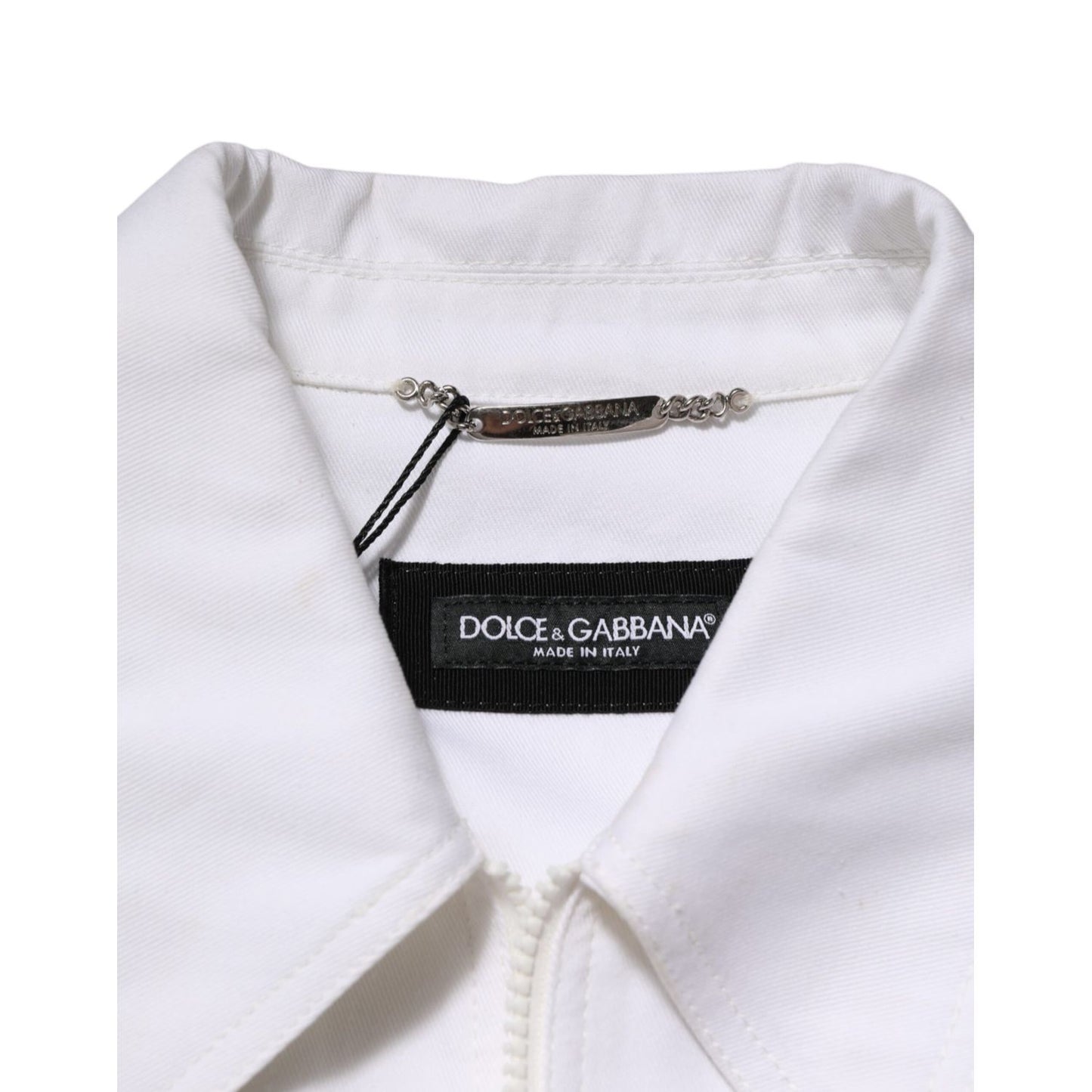Collar detail of Dolce & Gabbana White Barcode Patch Utility Zip Jumpsuit Pants with brand label visible.