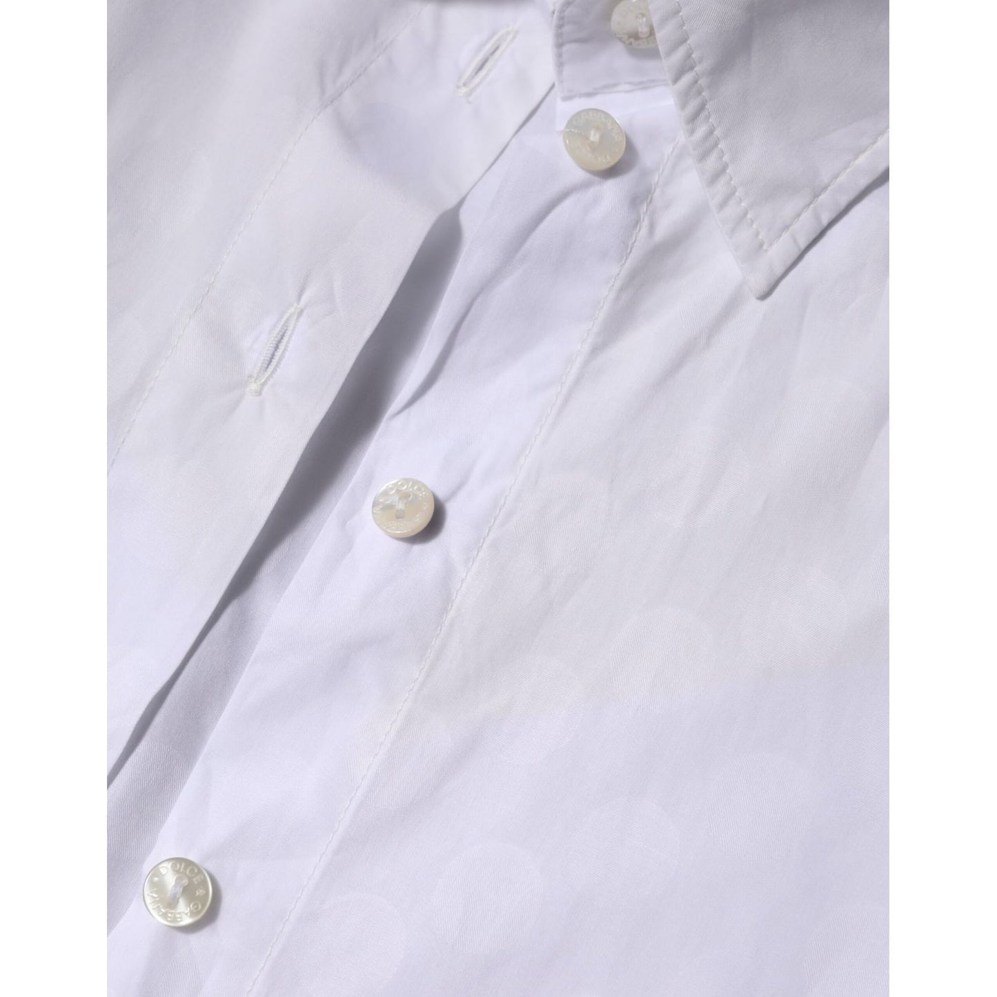 Close-up of Dolce & Gabbana White Collared Short Sleeve Polo Shirt Top, featuring buttons and detailed stitching.