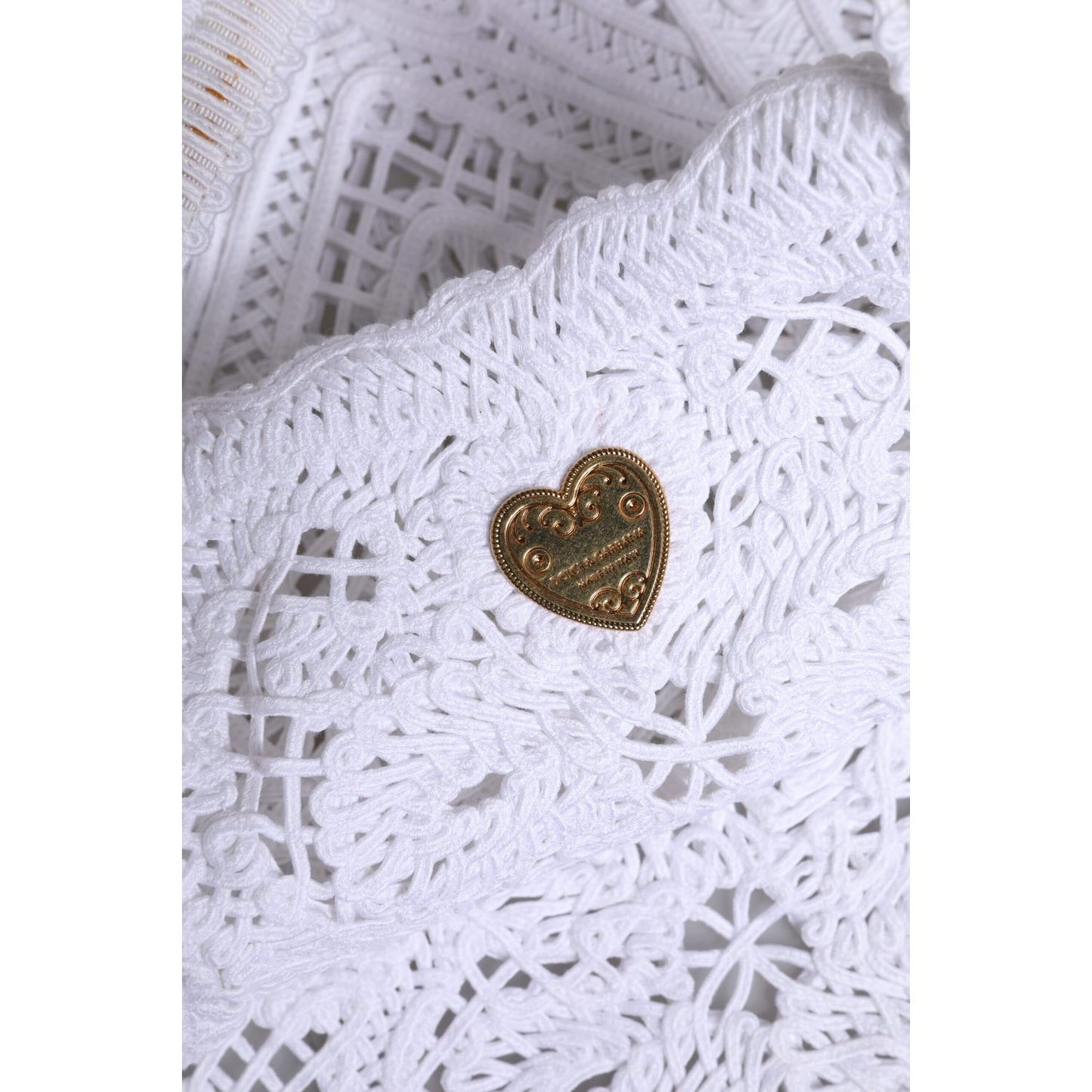 Close-up of Dolce & Gabbana White Cordonetto Lace Beatrice Tote Shopping Bag with heart motif in the lace.