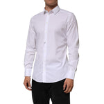Man wearing Dolce & Gabbana White Cotton GOLD Long Sleeves Formal Men Shirt with sleek design and button closure, made in Italy.