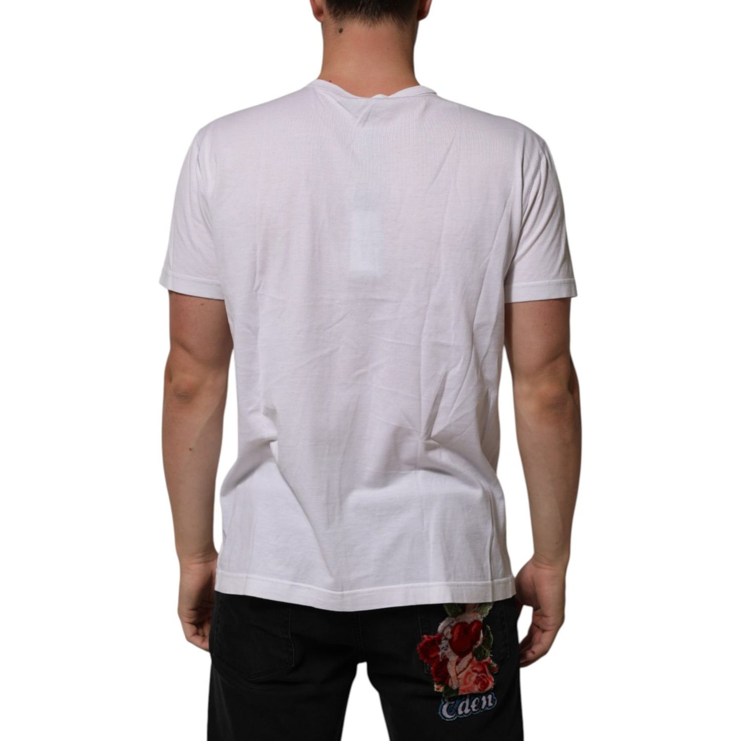 Back view of man wearing Dolce & Gabbana White Cotton Logo Patch Crew Neck Men T-shirt, showcasing fit and style.