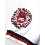 Close-up of Dolce & Gabbana White #DGMillennials King Crown V-neck T-shirt embroidered logo sleeve detail.