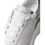 Close-up of Dolce & Gabbana White Silver Leather Sport DAYMASTER Sneakers showing logo and stitching details.