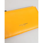 Dolce & Gabbana Yellow Orange Leather Credit Card Key Holder Clip On Wallet showcasing vibrant color and logo detail.