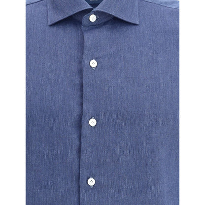 Close-up of Finamore Blue Cotton Dress Shirt with classic collar and button closure, 100% cotton fabric for elegant, everyday wear.