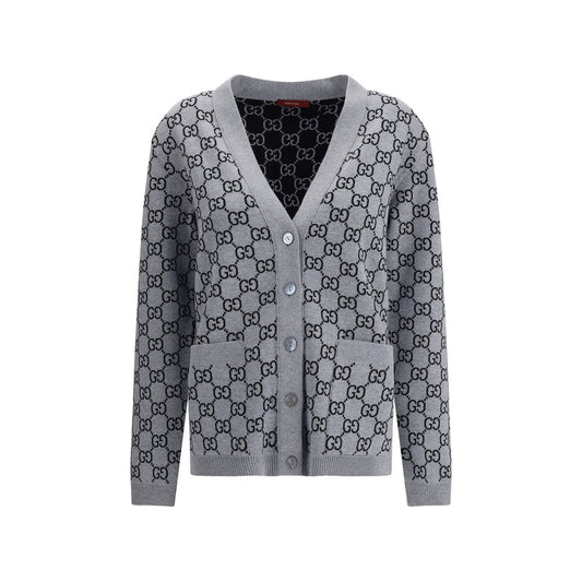 Gucci Black Wool Cardigan with GG Supreme reversible pattern, V-neckline, front pockets, and ribbed trim in black and white.