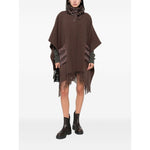 Herno Jackets Brown quilted poncho with high neck, drawstring detail, and fringe trim, showcasing style and comfort in women's fashion.