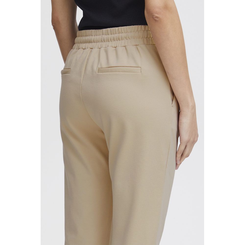 Back view of ICHI Beige Polyester Pant with elastic waistband and tailored fit, highlighting comfort and style for modern women.