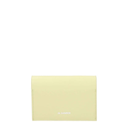 Jil Sander Yellow Leather Cardholder with front logo, casual style, button closure, and three card slots; leather document holder.