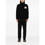 Maison Kitsuné MAISON KITSUNE' Sweaters Black wool jumper with logo print, crew neck, and ribbed cuffs worn by model
