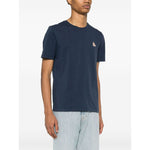 Model wearing navy blue Maison Kitsuné Maison Kitsune Bold Fox Head cotton T-shirt with Chillax Fox motif and crew neck.