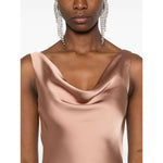 Norma Kamali Dresses Beige featuring a golden brown cowl neck sleeveless Maria gown with full lining and flared hem.