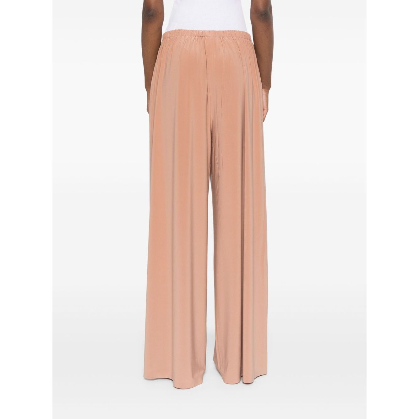 Back view of Norma Kamali Trousers Beige with elasticated waistband and wide leg design.