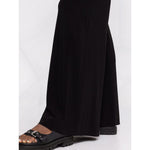 Norma Kamali Trousers Black high-waisted flared Elephant jersey with side slit pockets, regular length.