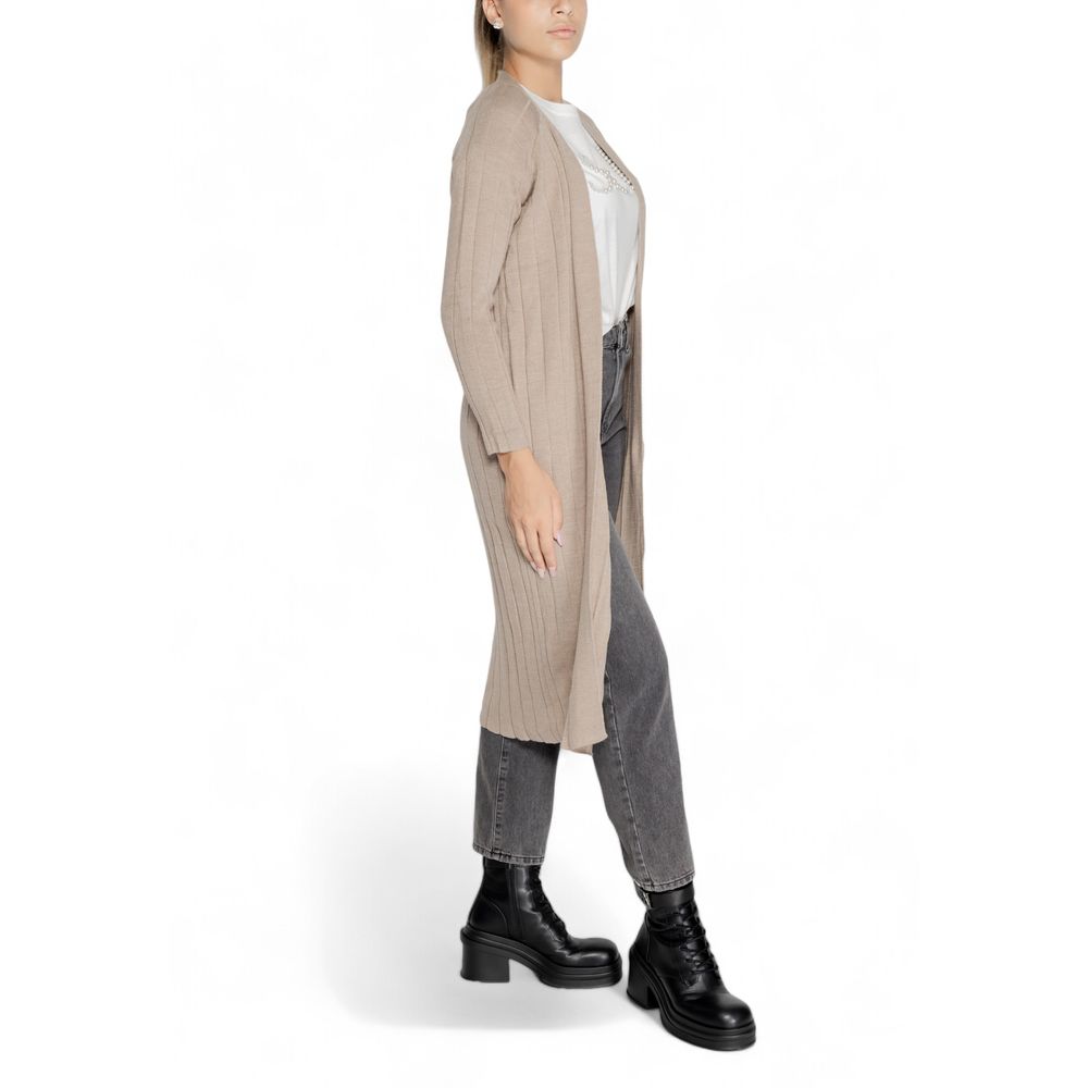 Model wearing Only Beige Marabou Cardigan over casual outfit, showcasing long sleeves and open design for versatile autumn style