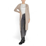 Woman wearing Only Beige Marabou Cardigan, long open design with long sleeves, ideal for layering, styled for autumn and winter fashion.