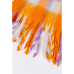 Close-up of Only Orange Polyester Scarf with checkered design and decorative fringes made from recycled polyester.