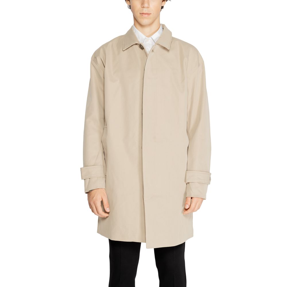 Man wearing Only & Sons Beige Polyester Trench Coat, featuring a minimalist design with button-up front and classic collar.
