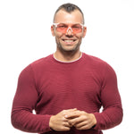 Man wearing red sweater and stylish sunglasses smiling at the camera