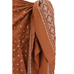 Close-up of PINKO Bandana pattern pareo Skirt showing vibrant design, knotted detail, and secure zipper for fresh summer appeal.