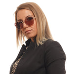 POLAROID MOD. PLD 4093_S 59DDB_0F sunglasses worn by woman in black blazer, stylish eyewear for ladies.