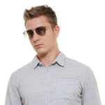 Police Silver Men Sunglass worn by a male model, featuring silver frame and mirrored lenses, offering 100% UVA & UVB protection.